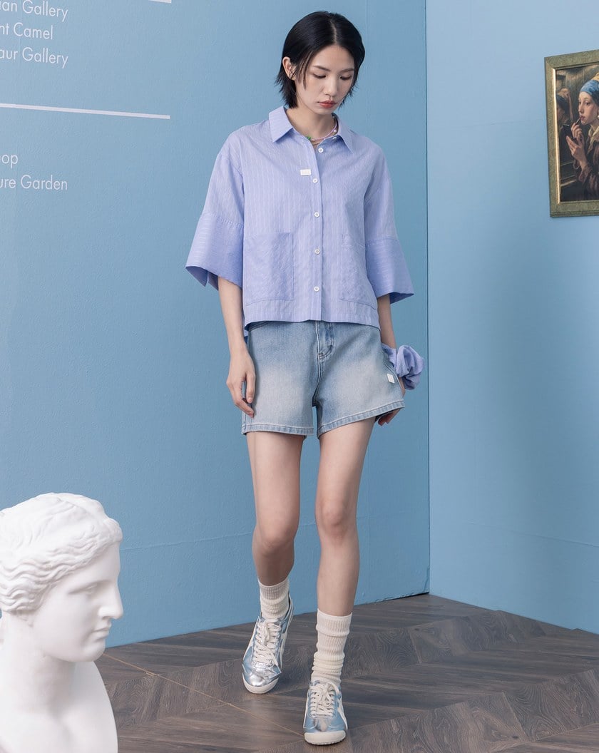 顯瘦剪接皮標牛仔短褲